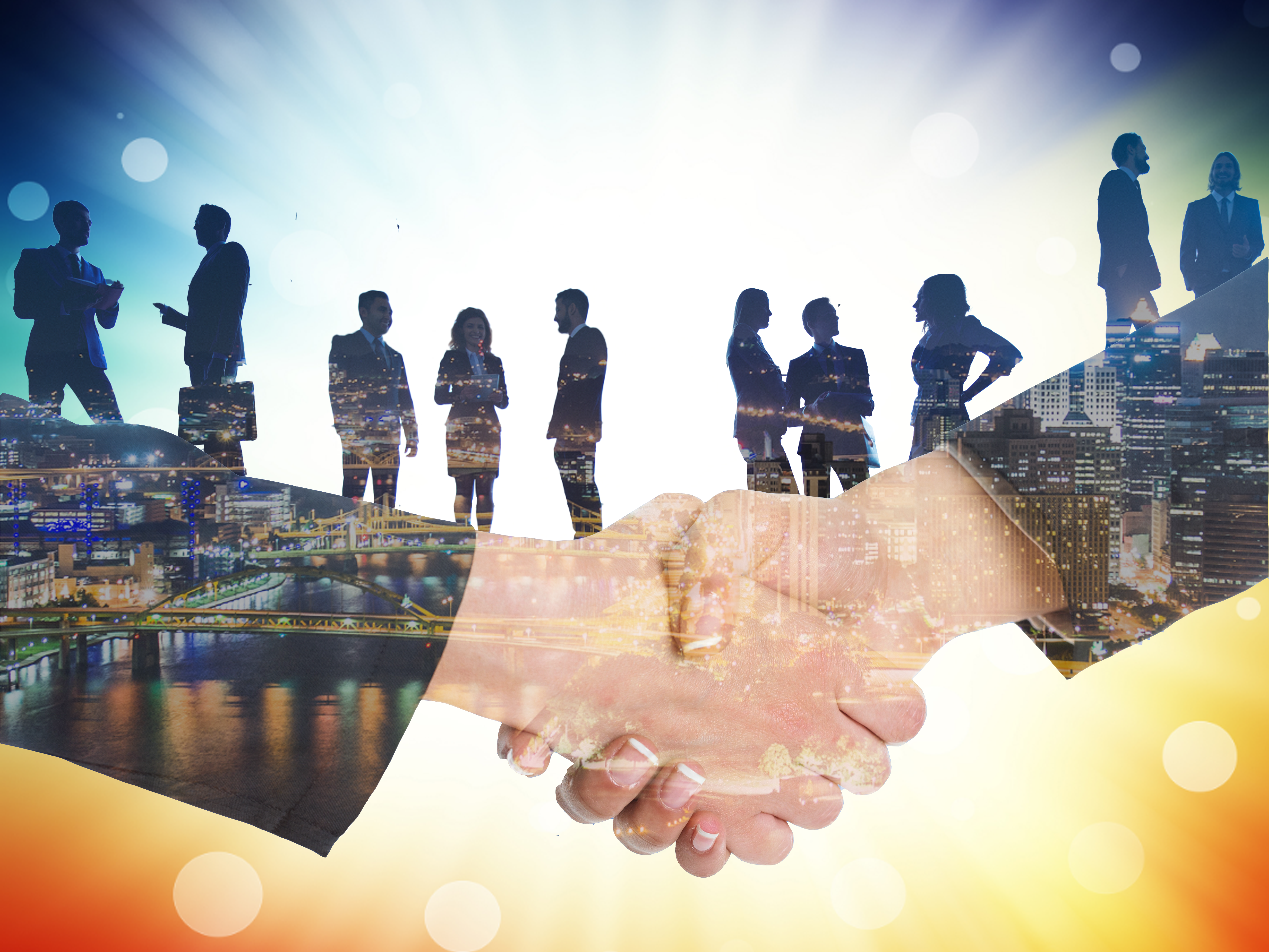 Silhouettes of people with Pittsburgh in the background